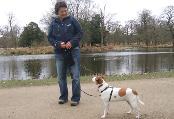 Zsuzsa training her dog, Daisy, in the park.